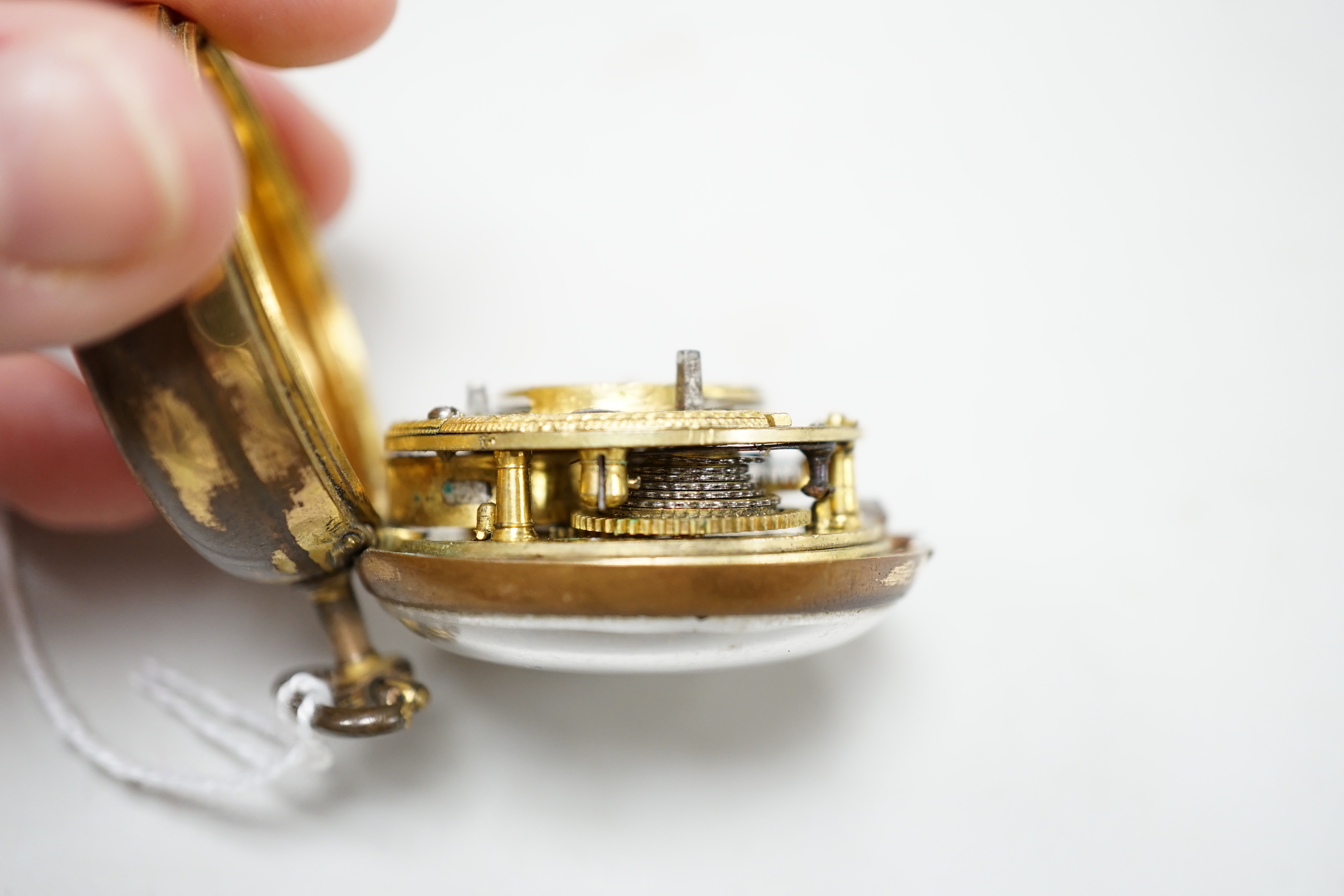 An 18th century gilt metal pair cased keywind verge pocket watch, by William Hope, London, with Roman dial, the signed movement numbered 1523.